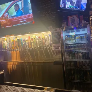 a bar with beer taps