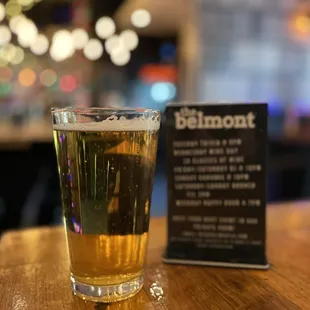 a glass of beer on a table