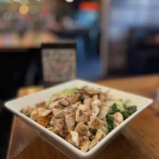 a bowl of chicken and broccoli