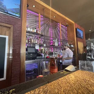 a bartender at the bar