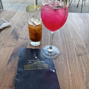 Spicy  Bloody Mary and a Dragon Fruit Cocktail in a wine glass
