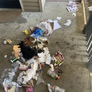 Trash bag broken and garbage strewn all over