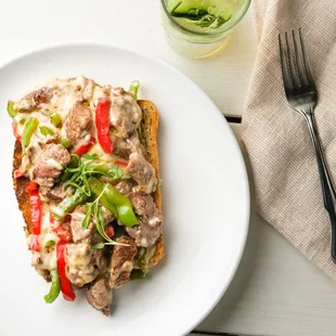 Cheese steak for breakfast?  You got that right.  We offer a sliced 6 oz filet on toast, topped with bell peppers and jack cheese.