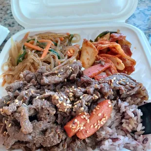 Beef bulgogi bento with jap chae and kimchi after a couple bites