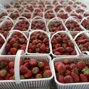 a lot of strawberries in baskets