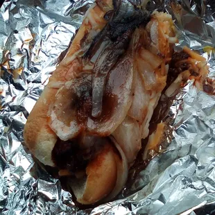 The chili cheese dog with grilled onions.
