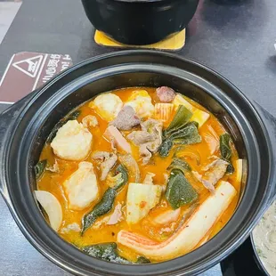 two bowls of soup and a plate of rice