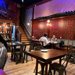 people sitting at tables in a restaurant
