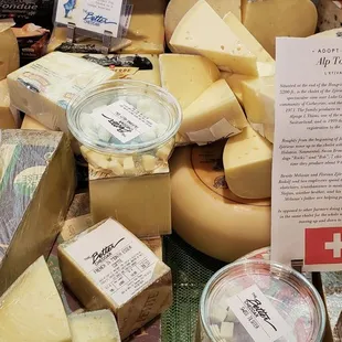 The sample cheeses are in the round plastic containers.