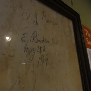 A portion of the wall signed by the Betts children during renovations in 1811.