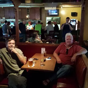 two men sitting at a table