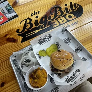 I'm having a chopped brisket combo meal with a giant-sized Grape cool-aid drink and a sweet potato casserole on the side!