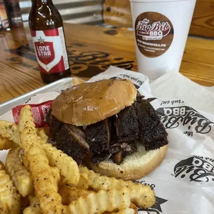 Brisket moist cut sandwich, buttered toasted buns, and generously seasoned crinkle fries.
