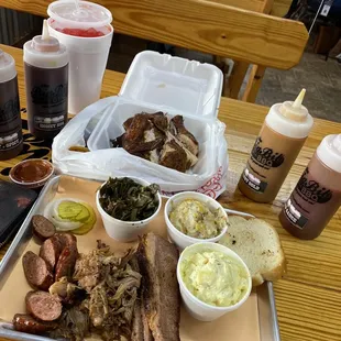 Sausage pulled pork brisket &amp; chicken with collard greens, loaded potatoes casserole and potato salad