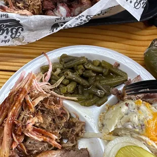 Pulled pork, sliced brisket, rib tips, green beans &amp; baked potato casserole. Everything is delicious!