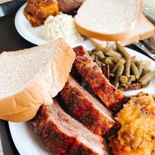 a plate of meat and sides