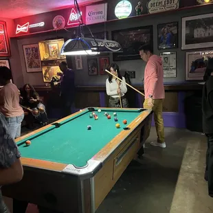 people playing pool