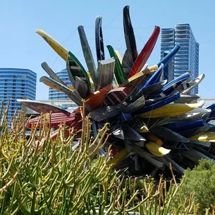A tree of canoes and boats grows out of the bushes. Actually this is a zoom in view of the Big Edge at City Center from the Aria.