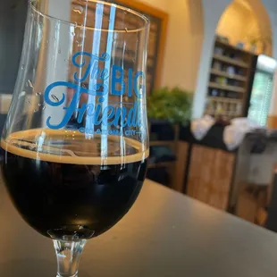 a glass of beer on a table