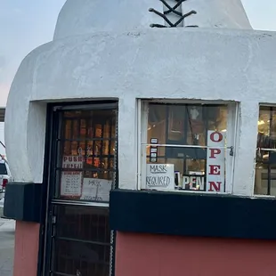 A Shoe Repair shop is inside this Humungous Shoe Shaped Building that's 25 feet tall &amp; 32 foot long@  The Big Shoe Repair in Bakersfield CA.