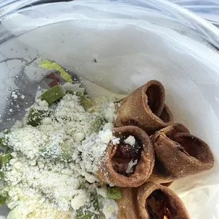 Shrimp taquitos on menu as flautas