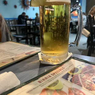 a glass of beer on a table