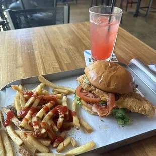 San Diego Fried Chicken sandwich with a side of French fries and a strawberry lemonade. Real good!