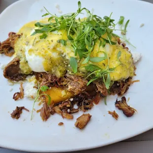 Biker's Benny with polenta poblano cakes, dill hollandaise, and carnitas.