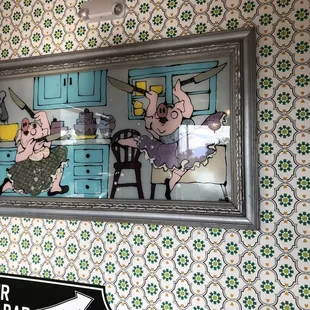 two pigs in a kitchen