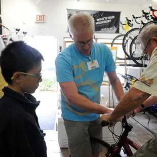 Ross getting a rental customer ready to ride the Bosque Trail.