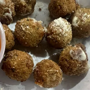 Cheese balls with sauce.
