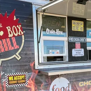 a food truck with a sign on it