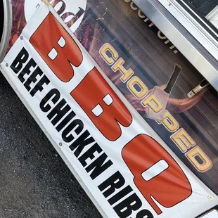 a bbq sign on the side of a truck