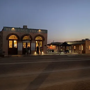 The outside of the birdcage theatre at dusk.