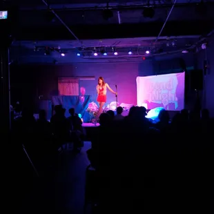 a woman performing on stage