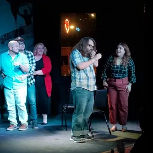 a group of people standing on a stage