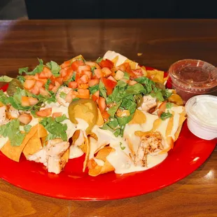 a plate of nachos on a table