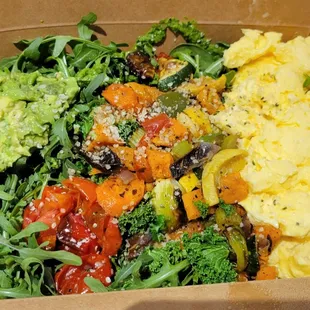 Henderson Hash - spinach &amp; arugula mix, scrambled eggs, seasonal roasted vegetables, avocado, spinach garlic pesto, hemp seeds