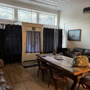 Main room- store front windows on either side of the door