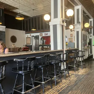 a woman sitting at the bar