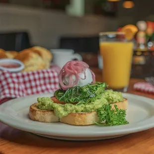 Avocado Toast with Poached egg and picked onions
