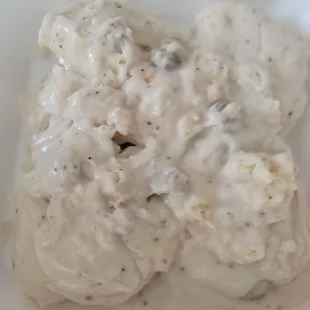 This is not a pile of vomit, it's our left over biscuits and black pepper sauce.