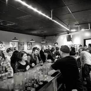 a group of people at a bar