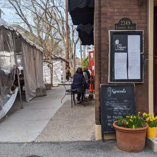 Outdoor dining - use the red door here for takeout or the side door for seating!