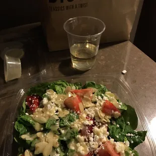 Arugula goat cheese almond strawberry salad.