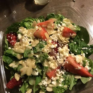 Arugula goat cheese almond strawberry salad.