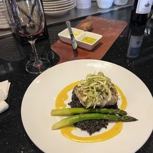 Pan fried sturgeon and black lentils with asparagus