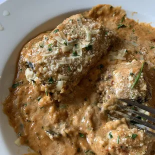 Eggplant rollatini with seasoned ricotta and a spinach-parmesan-vodka sauce.