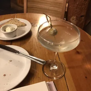 Dirty martini with blue cheese stuffed olives and gluten free bread.