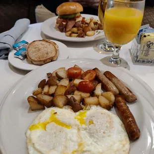 Sausage, egg, and potato breakfast. Egg, avocado, and bacon on brioche.